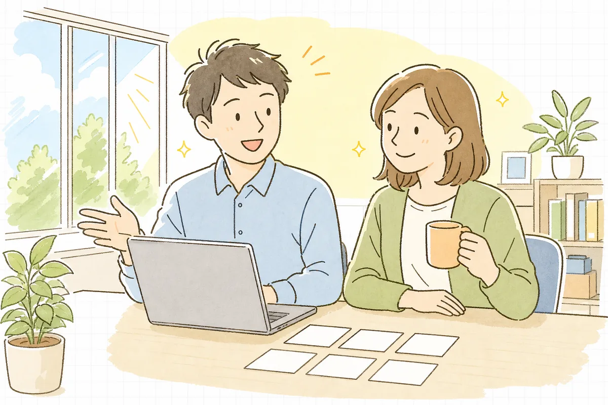 朝のオフィスで、依頼者の同僚と一緒に画面を見ながら、安心した表情でうなずき合っている開発者